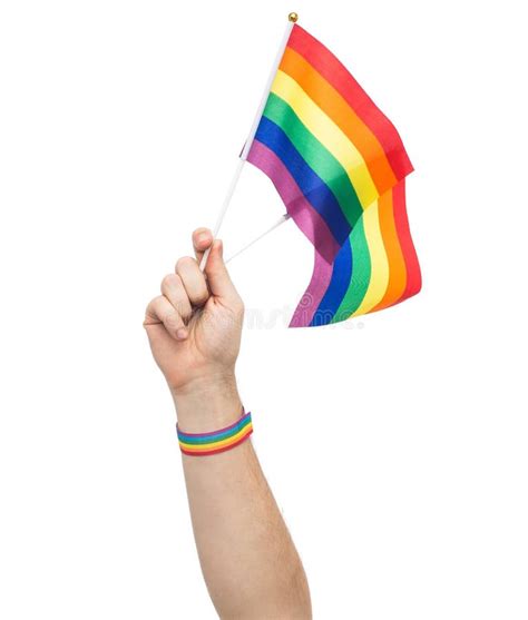 Hand with Gay Pride Rainbow Flags and Wristband Stock Image - Image of ...