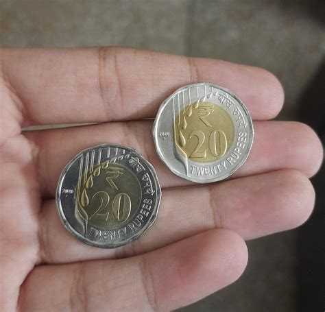 Finally got the new 20 rupee coins in circulation. They are really beautiful! : r/india