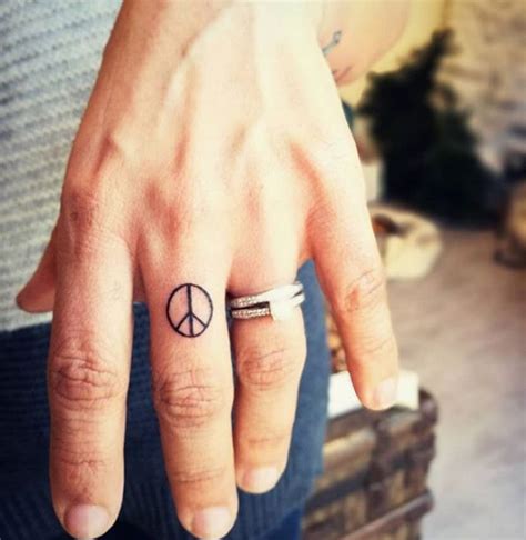 Peace sign by Charlene Paris | Hippie tattoo, Cute finger tattoos ...