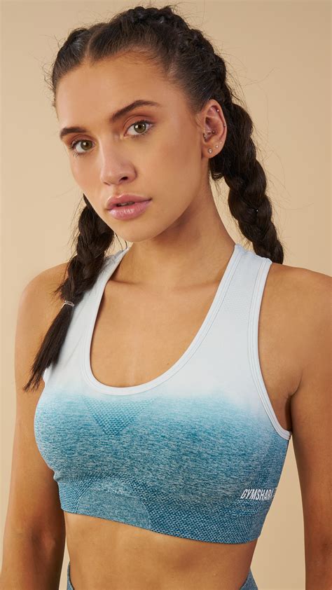 The Gymshark Ombre Seamless Sports Bra comes complete with removable pads and printed logo ...