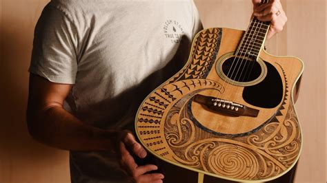 Carved a Māori design into a $2000 guitar. - YouTube