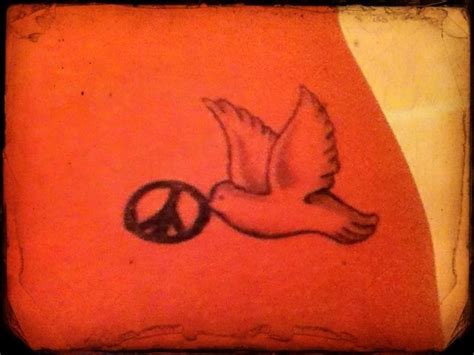 Peace and dove tattoo on my hip. I love it. Got it the day after ...