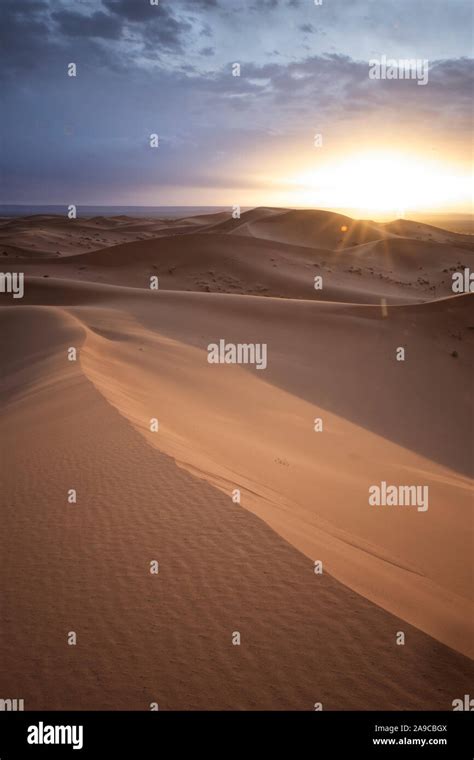 Sunrise at Sahara Desert with dunes Stock Photo - Alamy