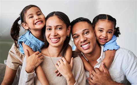 Premium Photo | Hug children and parents on the sofa in the living room of their house for love ...