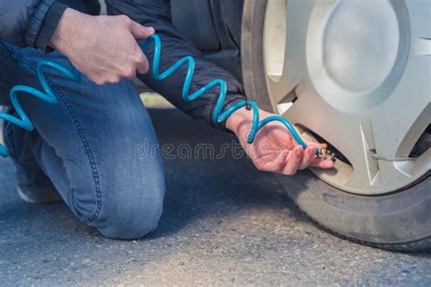 Filling the Car Tires with Air Using a Compressor Stock Image - Image of pressure, closeup ...