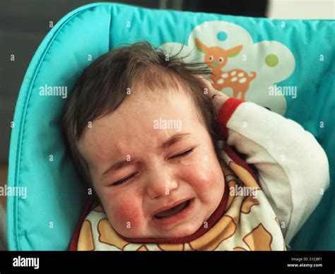 Baby crying portrait Stock Photo - Alamy