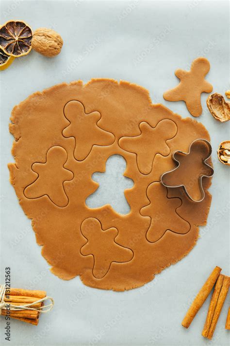 Gingerbread man cookie cutter with gingerbread dough Stock Photo ...