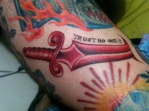 Trust No One – Red Ink Sword Tattoo On Right Half Sleeve