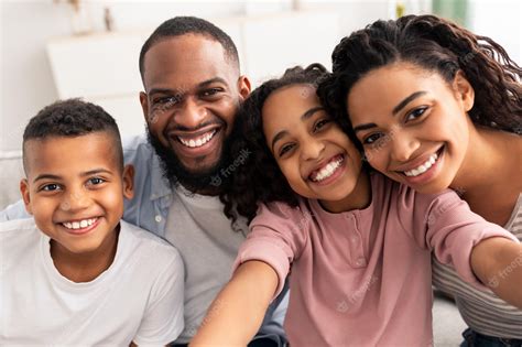 Premium Photo | Portrait of african american family taking a selfie ...