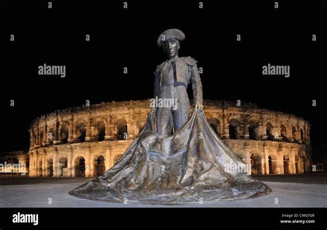 Bronze statue of matador Bull Fighter Nimeno II in front of Roman ...