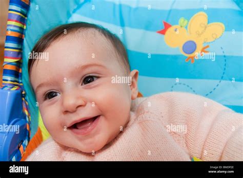 Baby girl laughing Stock Photo - Alamy