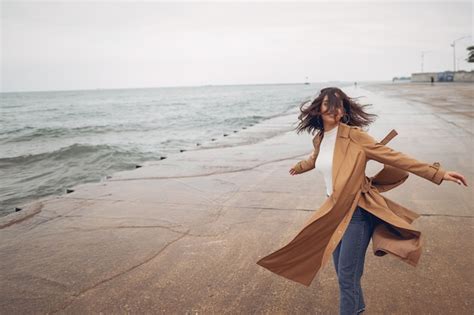 Free Photo | Young girl walking on the beach