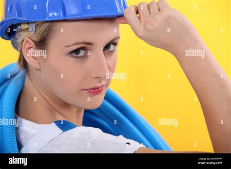 Construction worker giving a salute Stock Photo - Alamy