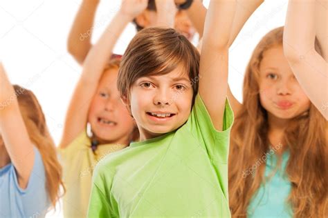 Kids cheering in the crowd Stock Photo by ©serrnovik 88603832