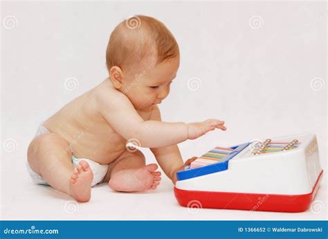 Baby with piano toy stock photo. Image of beauty, infant - 1366652