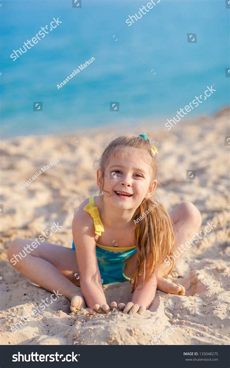 Little Girl Playing On Sand Beach Stock Photo 135048275 : Shutterstock