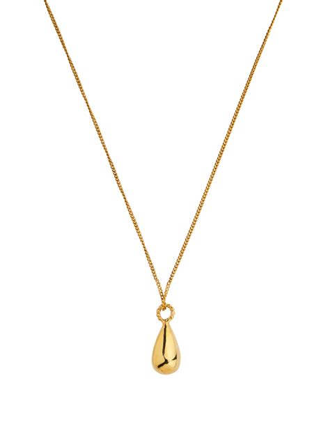Golden teardrop necklace by Martine Jans Jewellery | Finematter