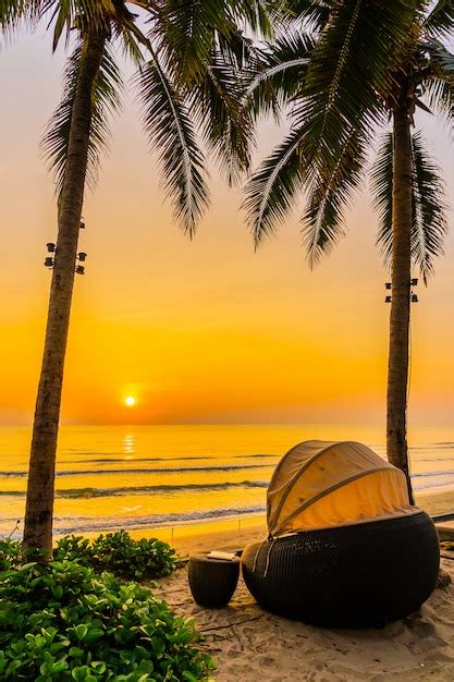 Free Photo | Umbrella and chair on the beautiful beach and sea at ...