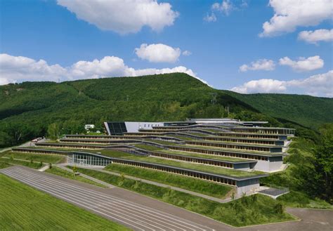Incredible green-roofed school blends into the mountain landscape | Green roof, Green roof ...