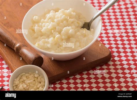 Brazilian dessert sweet canjica of white corn in bowl and towel Stock ...