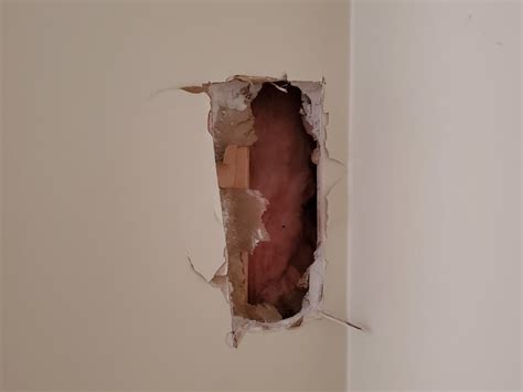 How to Repair Holes in Drywall With Spackle Update 2022