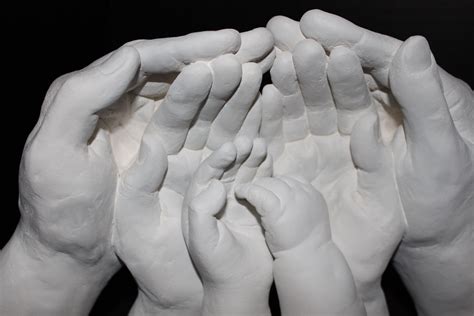 Family lifecast sculpture, father's hands, mother's hands, child and infant Contact: http://www ...