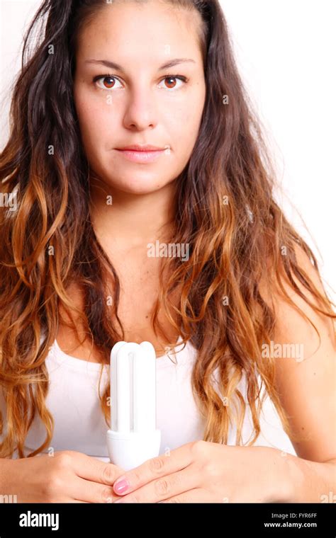 Girl with a energy saver light bulb Stock Photo - Alamy