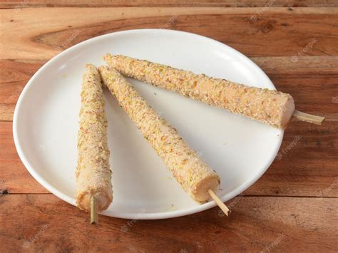 Premium Photo | Punjabi kulfi is an indian traditional stick ice cream 3 pieces of punjabi kulfi ...