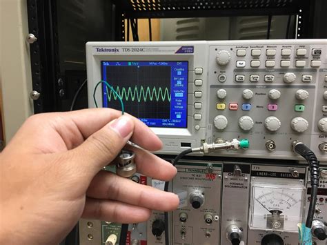 My oscilloscope picks up 600kHz sine wave signal when connected to an ...