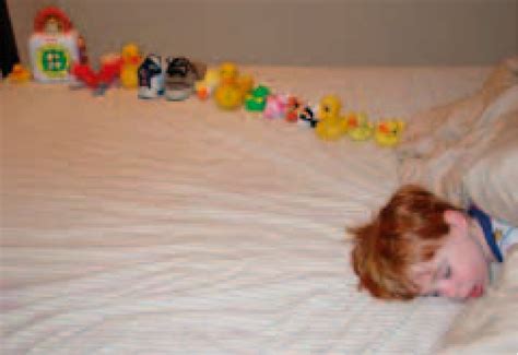 Autistic boy with his line of toys-given as an example of the... | Download Scientific Diagram