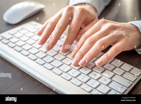 Female hands typing on keyboard Stock Photo - Alamy