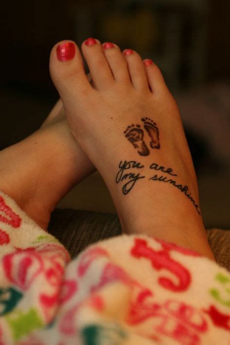 Baby feet tattoo