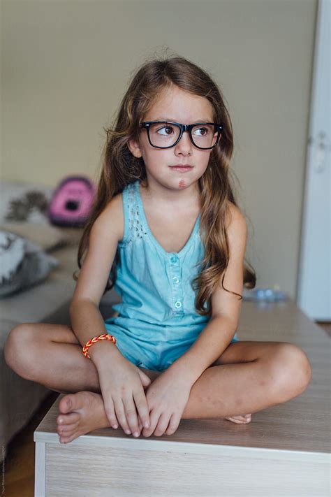 Little Girl Wearing Glasses by Dejan Ristovski