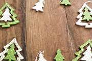 Photo of Festive frame of green Christmas tree ornaments | Free ...