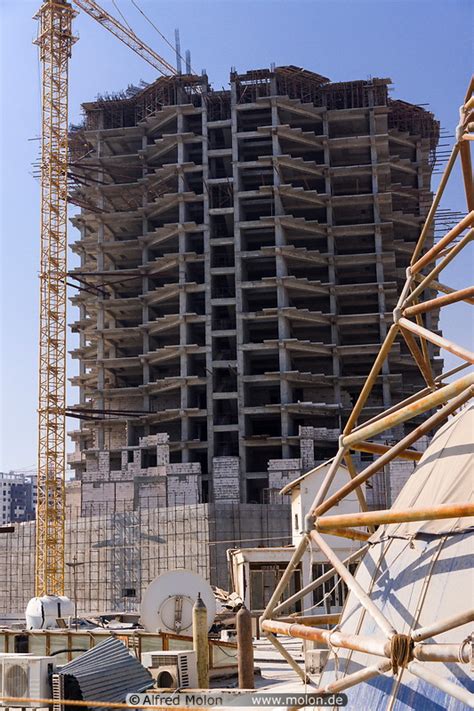 Photo of Skyscraper construction site. Qeshm city, Qeshm island, Iran ...