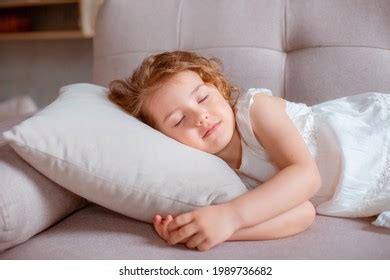 Little Girl Lying On Couch Stock Photo 1996942100 | Shutterstock