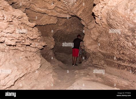 Tourist in the salt caves, Valle de la Luna (Moon Valley), San Pedro de Atacama, Antofagasta ...