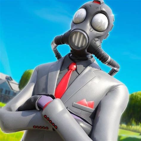 a man in a suit with a gas mask on his head and arms crossed, wearing a red tie