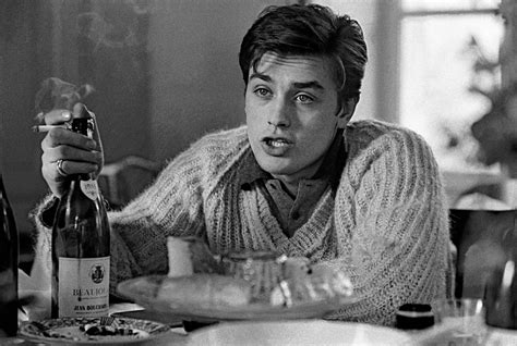 1959, Cannes, Alain Delon, actor, with bottle