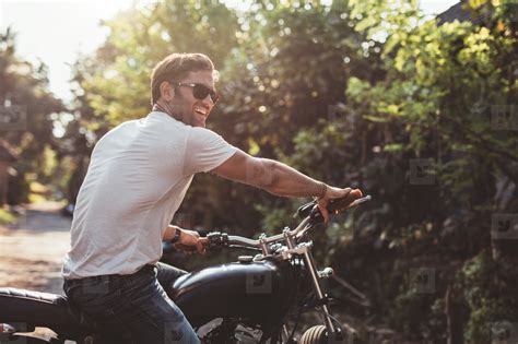 Handsome young man on motorcycle stock photo (124064) - YouWorkForThem