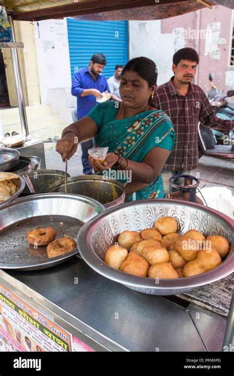 Preparing and selling Indian street food in a food stall. Photographed ...