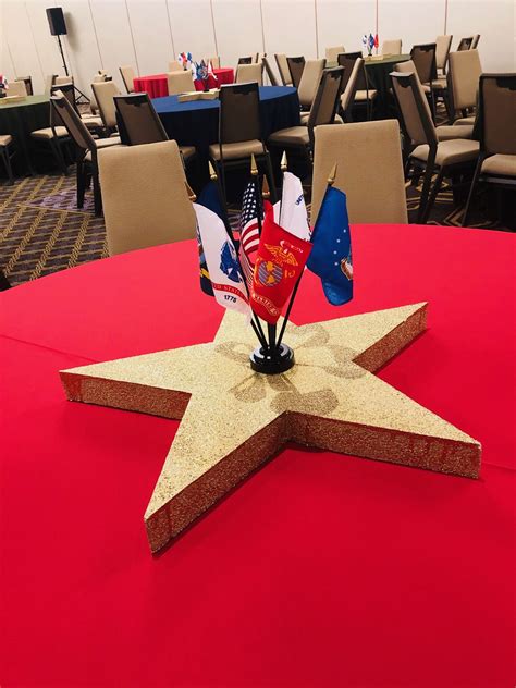 Nothing is more patriotic for this military theme than this gold star and flag centerpiece ...