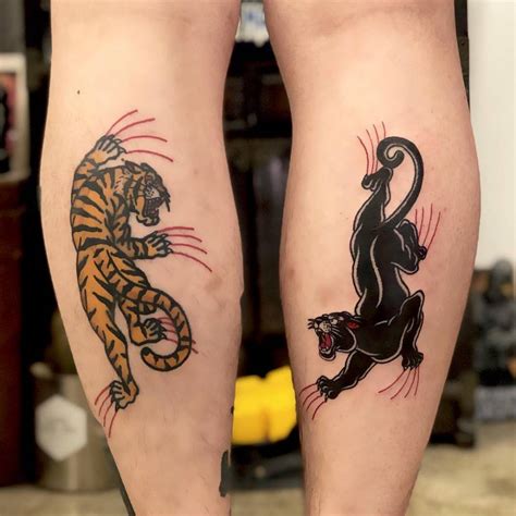 Matching tiger panther tattoo.