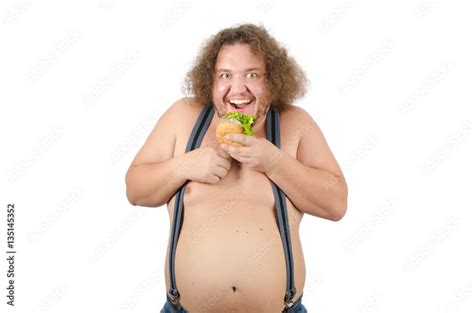 Fat man eating a hamburger. Hunger and burger. Funny guy shirtless and ...