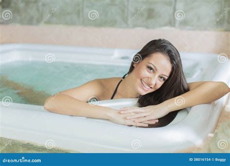 Young Woman Relaxing in the Hot Tub Stock Photo - Image of body, bubble: 38016154