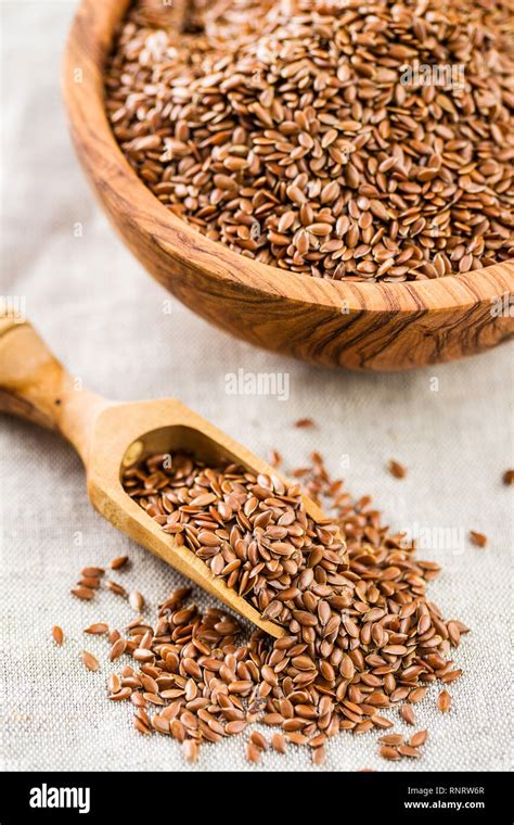 Flax seeds, linen seeds or linseeds in wooden scoop Stock Photo - Alamy