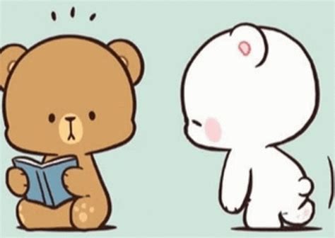 a brown teddy bear reading a book next to a white stuffed animal holding a blue book