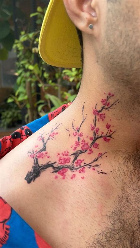cherry blossom neck tattoo by Anupriya Satish | Tattoos for guys, Cherry blossom tattoo, Cherry ...
