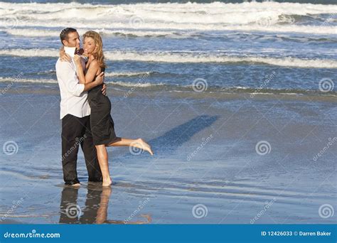 Man and Woman Couple in Romantic Embrace on Beach Stock Image - Image of embracing, ocean: 12426033