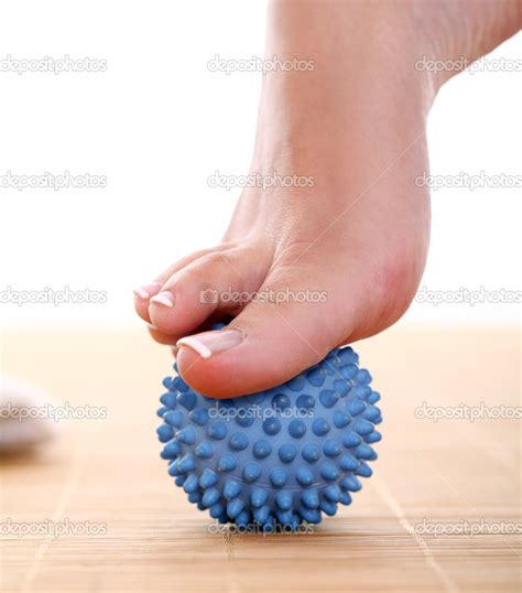 Beautiful foot with massage ball — Stock Photo © yekophotostudio #21070577